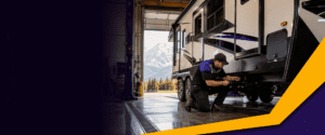 Runners RV service technician working on an RV in the Cranbrook service bay