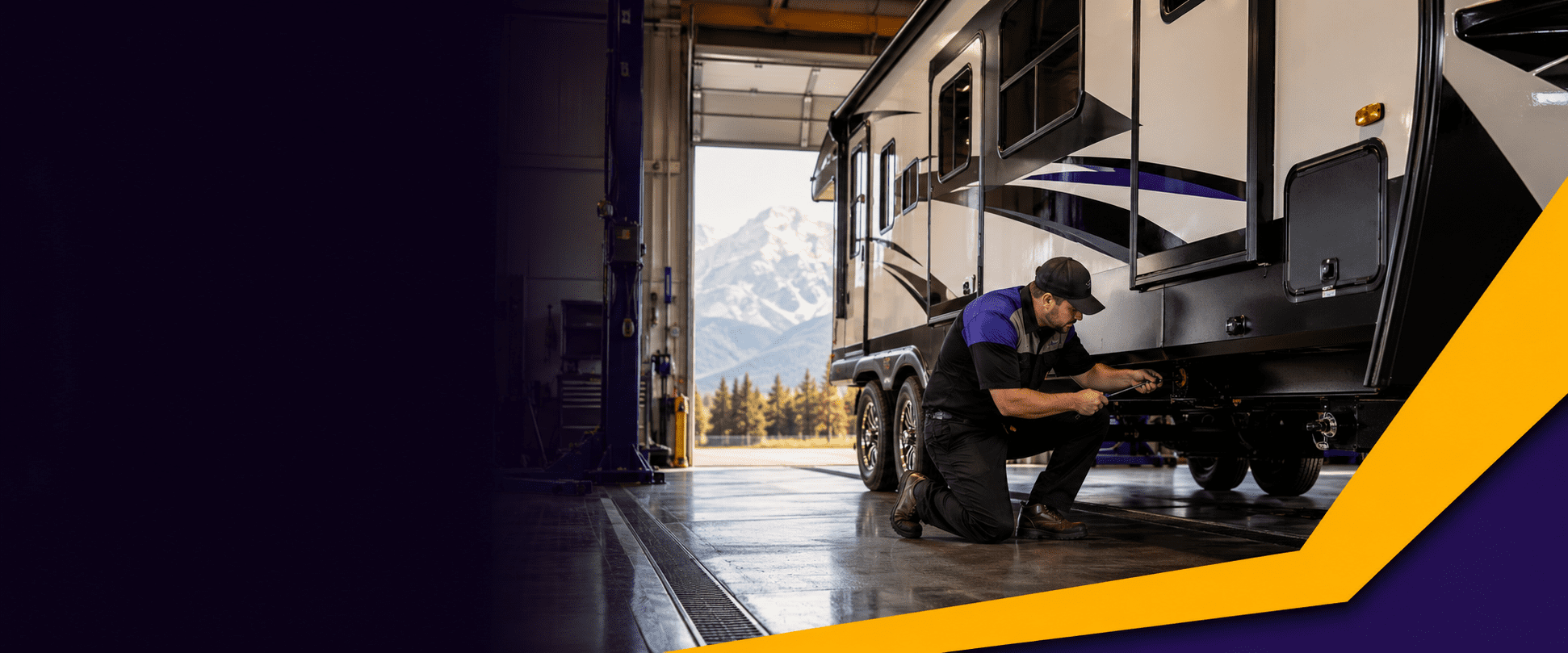 Runners RV service technician working on an RV in the Cranbrook service bay