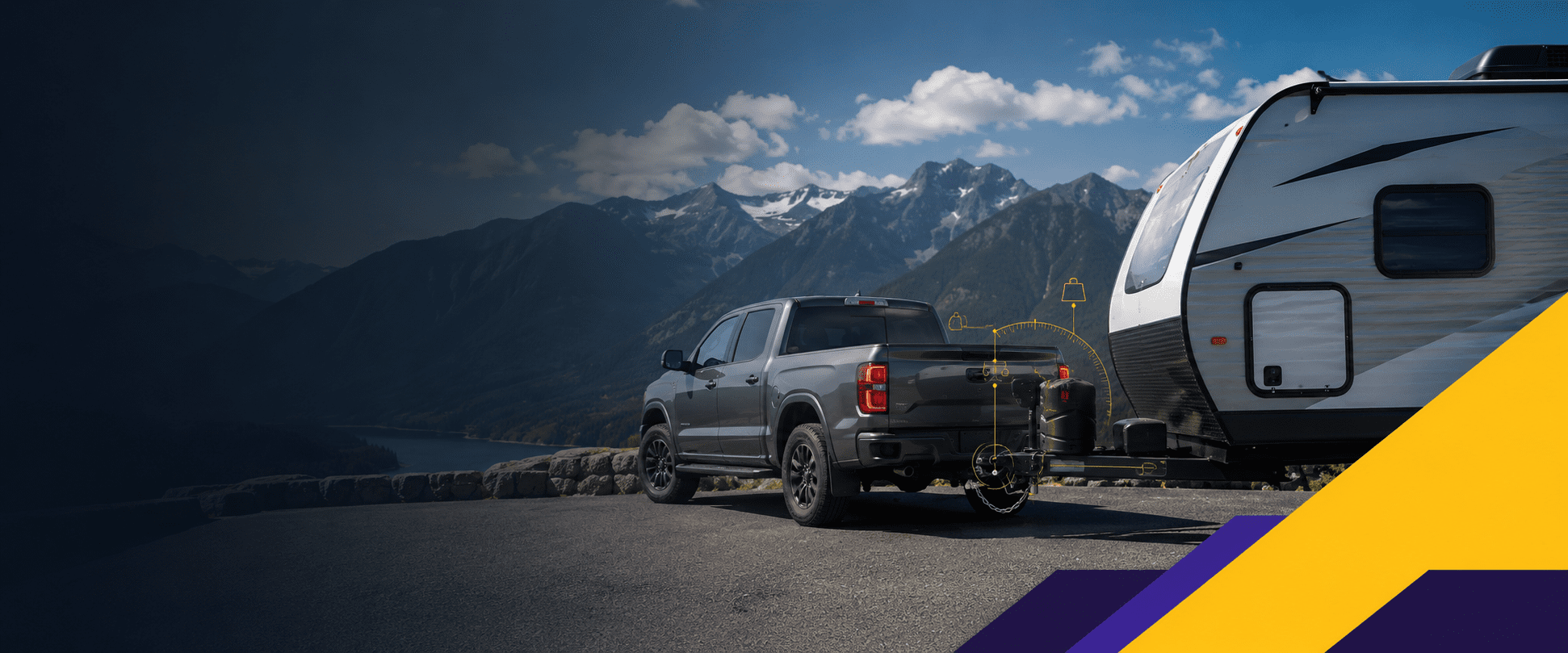 Pickup truck towing a travel trailer at a Rocky Mountain viewpoint near Cranbrook BC